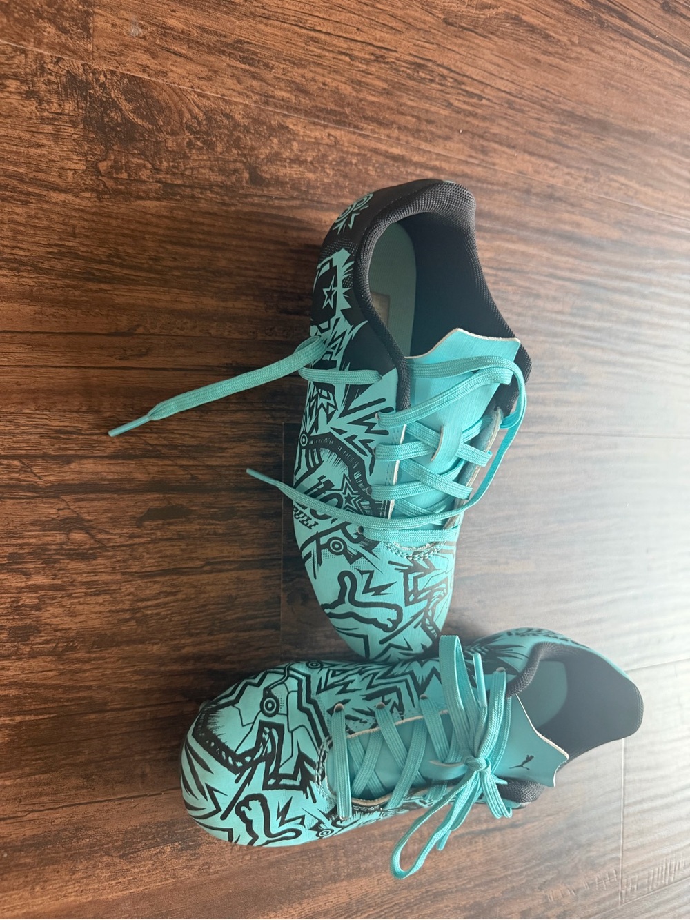 Puma Turquoise cleats Bous size 1.5